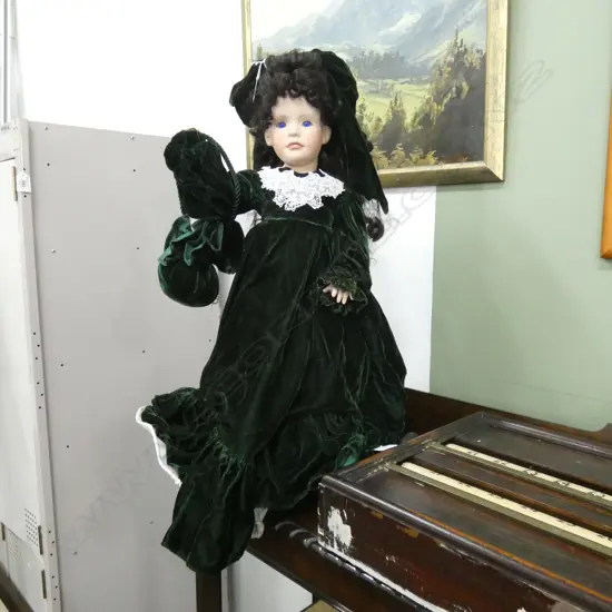 DOLL IN GREEN VELVET DRESS H.670mm
