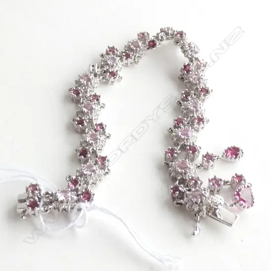 An 18ct white gold, diamond and pink tourmaline bracelet,