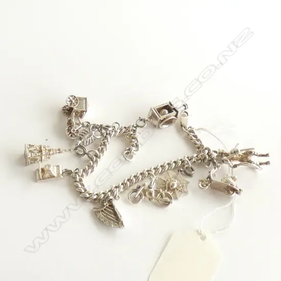 (60) SILVER CHARM BRACELET W 10 CHARMS
