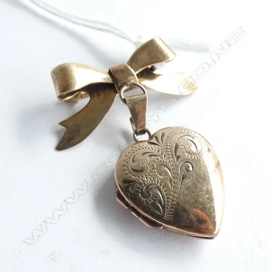(002) 9ct on STERLING HEART LOCKET ON BOW BROOCH
