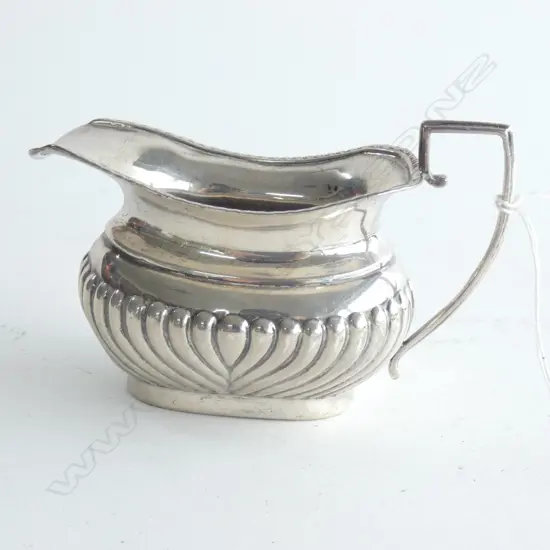 An Edwardian cream milk jug