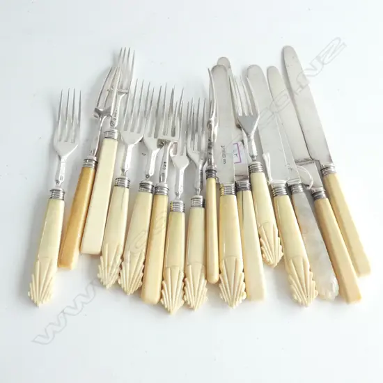 Two part silver and ivory handled fruit knife and fork sets