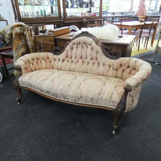 A Victorian walnut framed sofa,