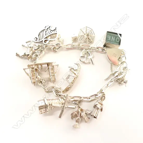 SILVER CHARM BRACELET WITH 13 CHARMS 62gm