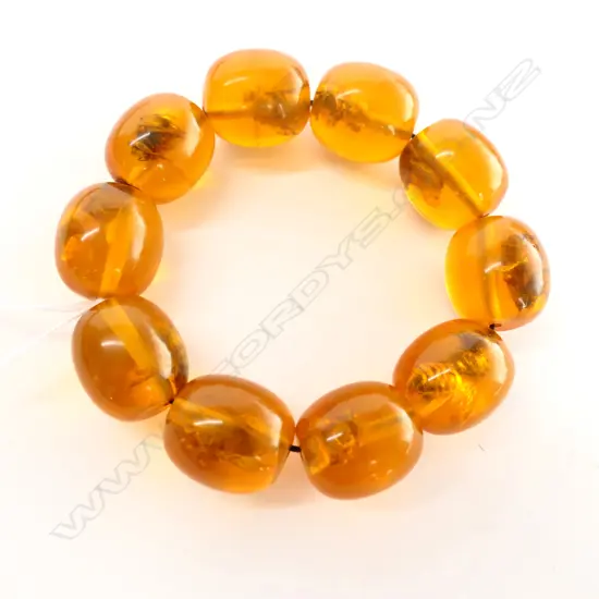 RECONSTITUTED AMBER? WITH FLIES INSIDE