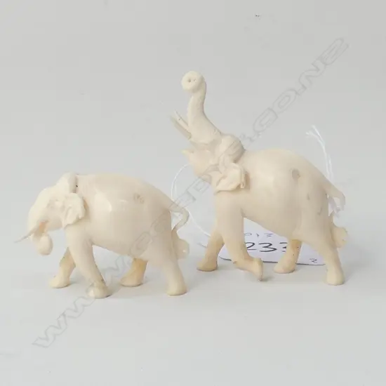 2 SMALL IVORY ELEPHANTS, ONE TRUNK UPWARDS