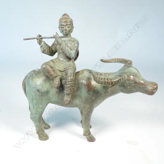 FLUTE PLAYING FIGURE ON BUFFALO L. 320MM