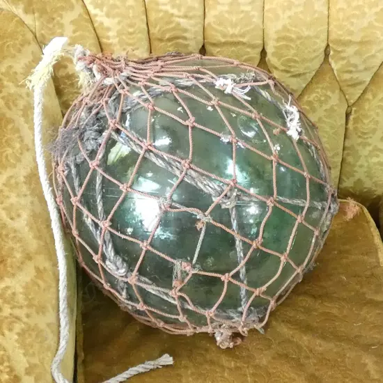 OLD LARGE GLASS FISHING FLOAT WITH NETTING