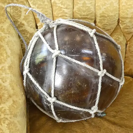 OLD LARGE GLASS FISHING FLOAT WITH NETTING