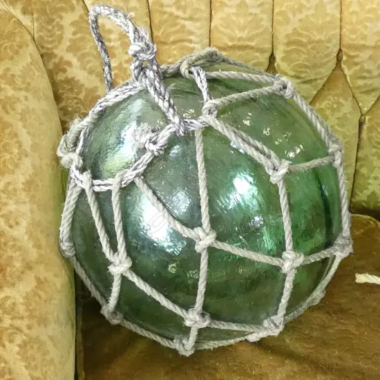 OLD LARGE GLASS FISHING FLOAT WITH NETTING