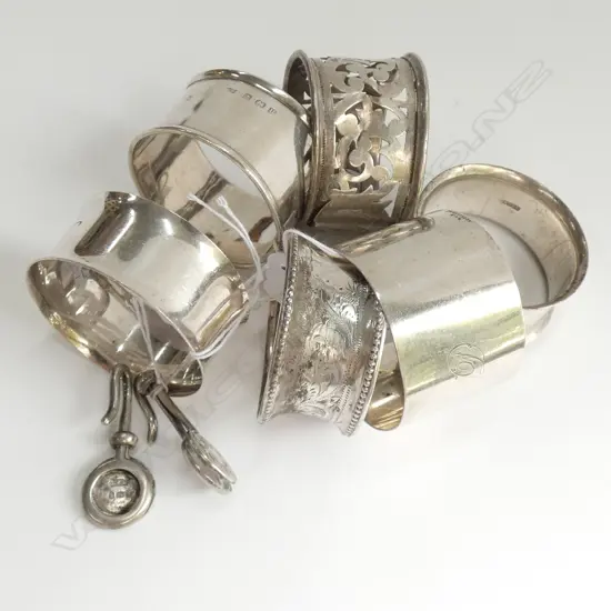 6 SILVER NAPKIN RINGS + 2 NAPKIN HOLDERS, TOTAL WEIGHT 124GM