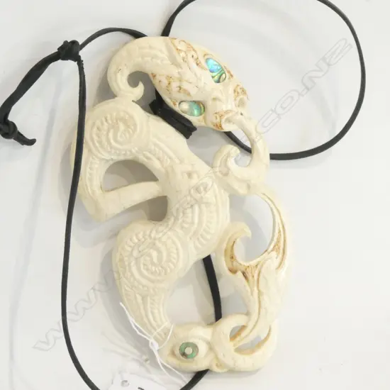 HANGING CARVED MAORI FIGURE OF A MANAIA