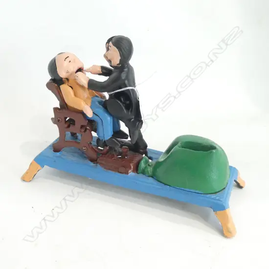 CAST IRON DENTIST MONEY BANK L. 220MM