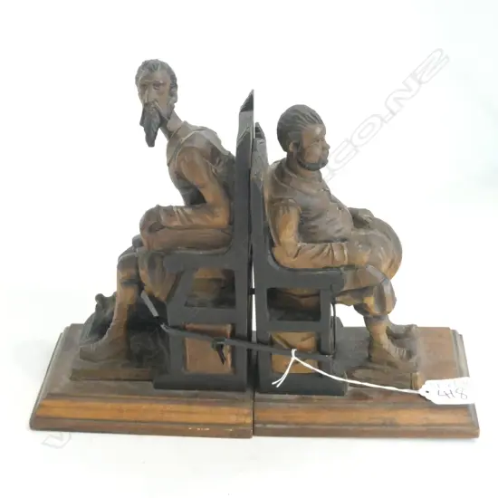 A PR OF VINTAGE HAND CARVED BOOKENDS