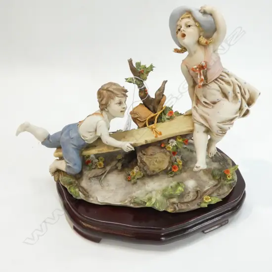 TRIADE FIGURE CHILDREN ON SEE SAW