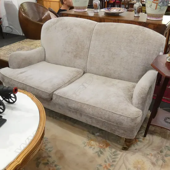 UPHOLSTERED ENGLISH ROLL ARM SOFA ON CASTORS/ WOODEN FEET. GREY/BEIGE VELVET TONES