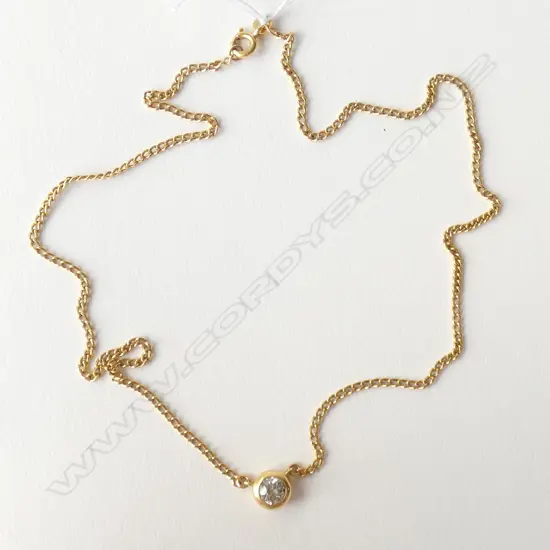 A modern 18ct. yellow gold and diamond pendant necklace
