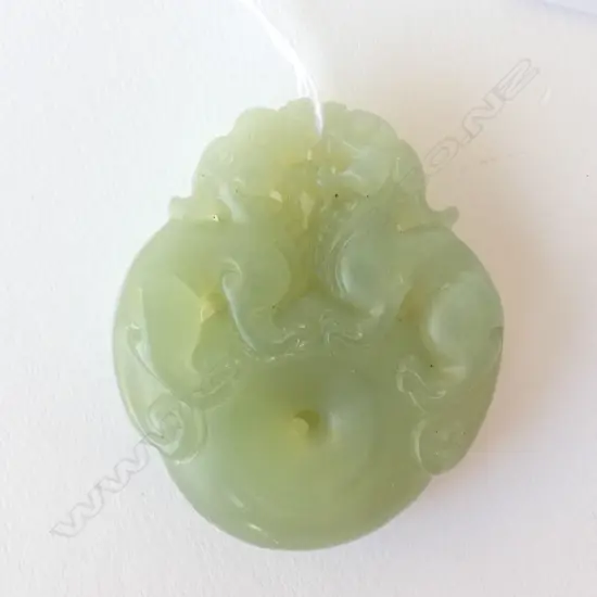 CHINESE JADE BI DISK PENDANT SURMOUNTED BY LION DOGS H. 45MM