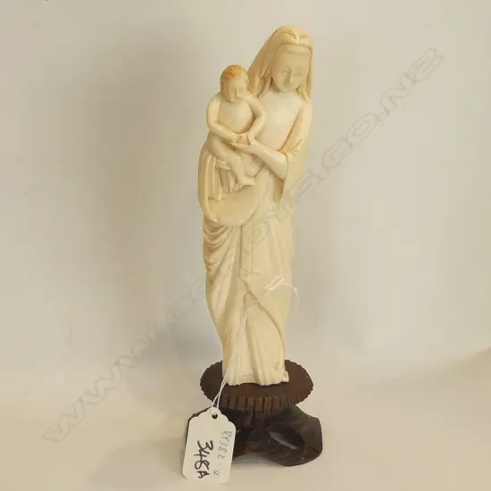 OLD IVORY CARVED FIGURE OF MADONNA & CHILD ON WOODEN STAND. H.220mm