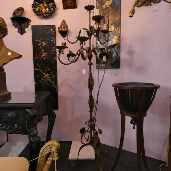 A mid-20thC tall gilt metal floor standing candelabra