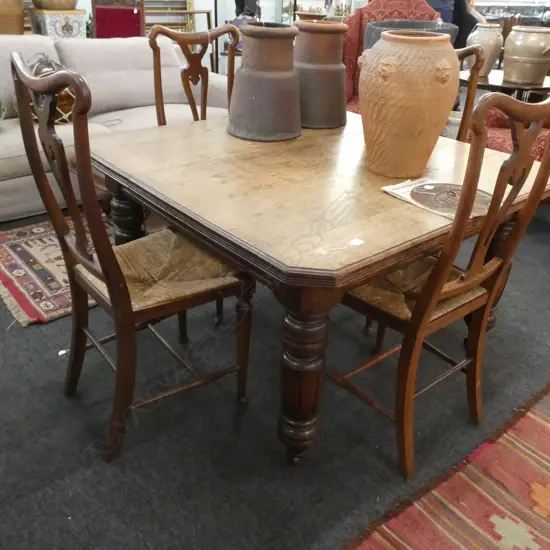 EARLY 20C OAK EXTENSION TABLE ON CASTERS + 1 EXTN