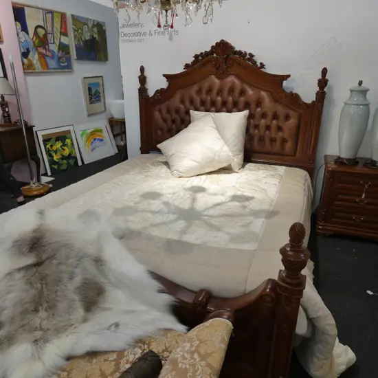 CARVED WOODEN BED WITH BUTTONED LEATHER HEADBOARD W. 1900MM L. 2160MM