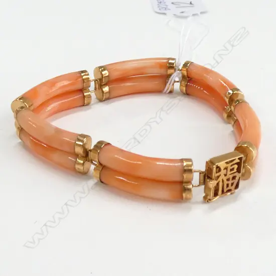 BRACELET..PINK CORAL(?) SET IN 14CT GOLD