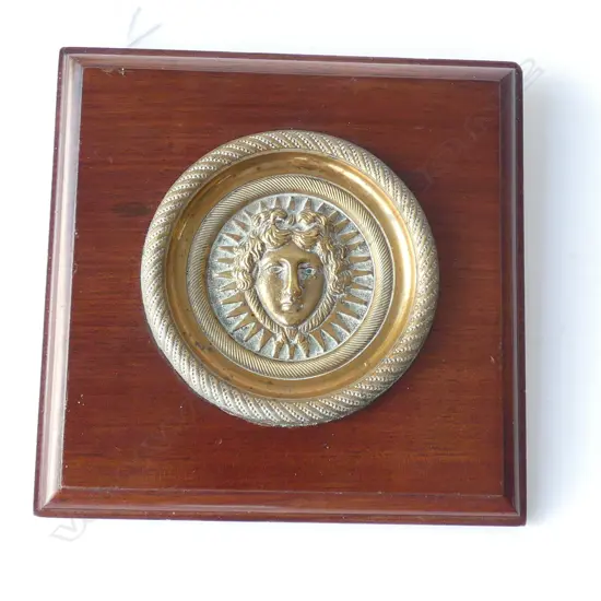 CIRCULAR ROMAN GOD PORTRAIT BRASS PLAQUE SET ON MAHOGANY SQUARE PANEL 