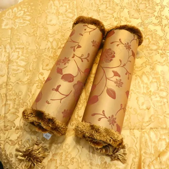 PAIR OF GOLD BOLSTER CUSHIONS