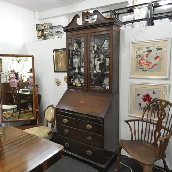 AN EDWARDIAN BUREAU BOOKCASE WITH INLAID SHELL MOTIF SOME FAULTS