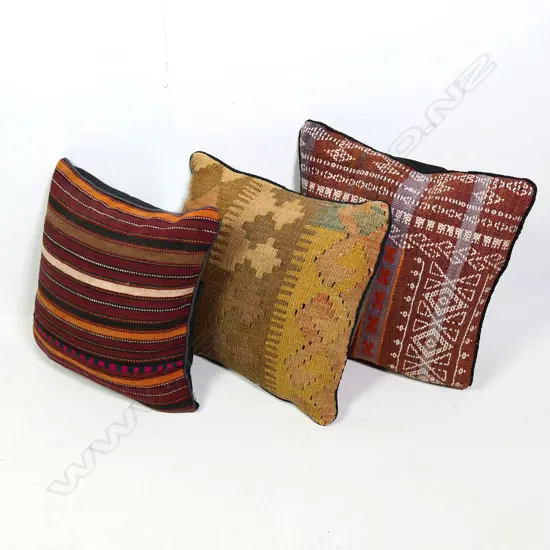 Three Persian rug covered cushions