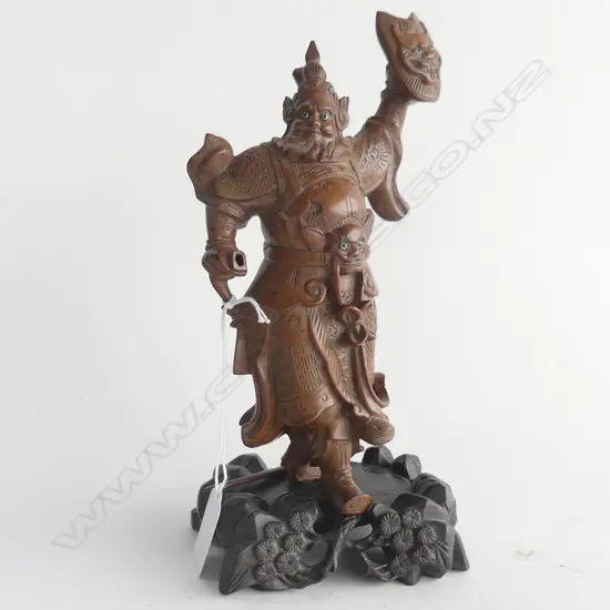 (23) A CARVED CHINESE WARRIOR WITH DETACHABLE SWORD SIGNED UNDER FOOT H. 230mm