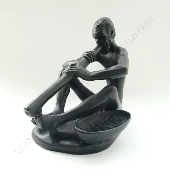 (14) AN ABORIGINAL MAN PLAYING A DIDGERIDOO TAKACS AUSTRALIA SIGNED TO BASE H. 190mm