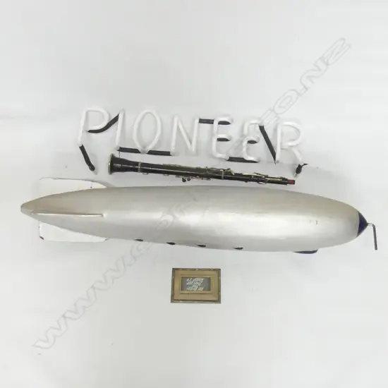 4 ITEMS INCL. CLARINET AF + 'BETTER THAN AVERAGE' BLIMP L. 880mm + PLAQUE + 'PIONEER' NEON AF
