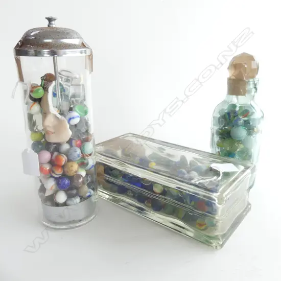 (81)  3 GLASS CONTAINERS CONTAINING MARBLES,OBLONG,CIRCULAR & AN OLD BOTTLE, STOPPERS DOLLFACE IN CIRCULAR ONE , H.270mm