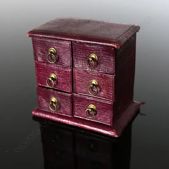 Maroon Leather Chest of Drawers, providing a Six-Postage Stamp Compartment