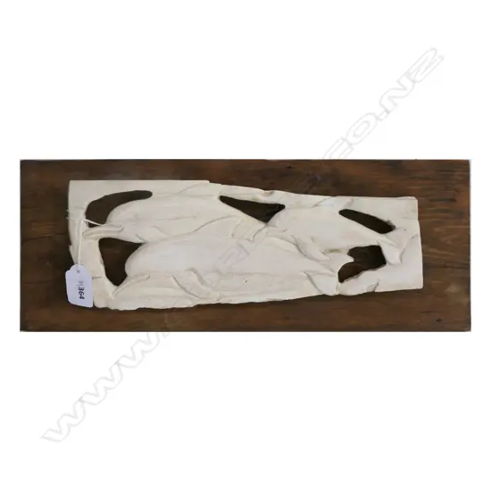 (M6) WHALEBONE SCULPTURE FEATURING THREE DOLPHIN ON WOODEN BACKING. L.400mm