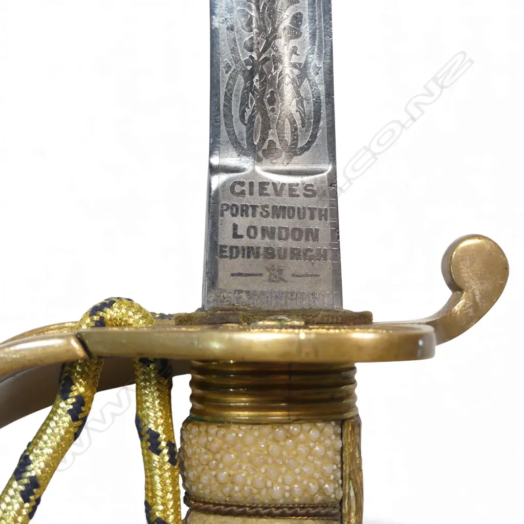 Royal Naval Reserve 1827 Pattern Officers Sword, 32 ½" narrow flat-back blade etched on the ricasso 'Gieves, Portsmouth, London, Edinburgh & Devonport'. Inset proof disc 'P'. Image 1++