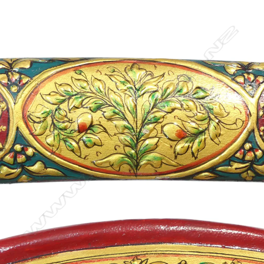 Two Tulwar Swords and matching Dahl Shield from the Punjab Region, India. A matching pair of 28" deeply-curved wootz blades with a gold cartouche to each; double-edged tips and serrated notch-backed to 3/4 of their lengths. The hilts are profusely gold damascened (one with a pommel spike, the other a dome). Matched leather scabbards with raised gilding on a red ground. Along with a matching Dahl shield, dia.20". Believed to have been made as a presentation set. Image 1++