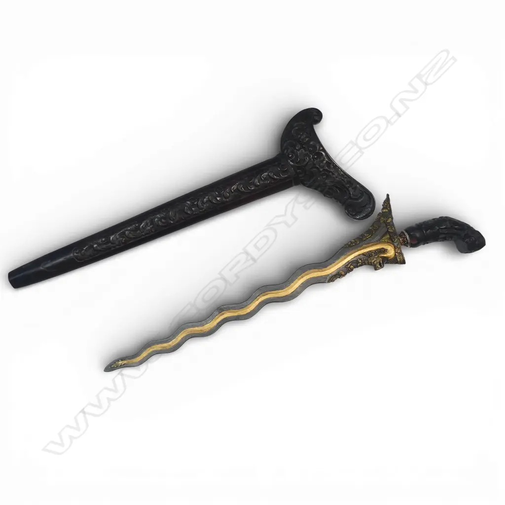 Indonesian Kris. (Balinese) with highly decorated 14½"wavy blade. The 13 luk blade decorated with the gilded tail of a naga whose head is carved at the ricasso. Image 1++