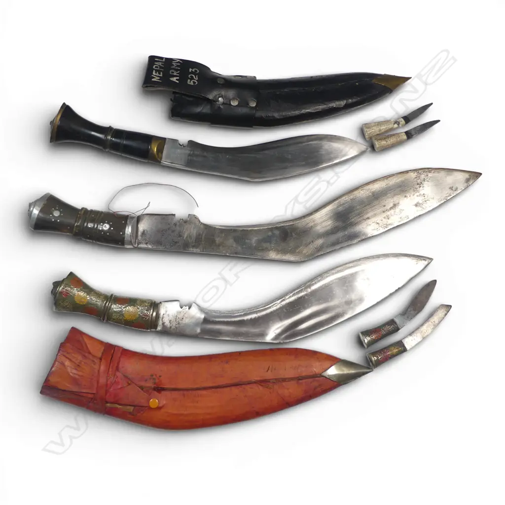 Three Nepalese/Indian Khukri. Two with scabbards, one Nepalese Army pattern (damaged small knife). Longest 490mm Image 1++