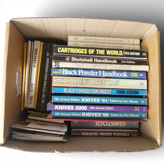 A collection of books and periodicals related to firearms knives and cartridges