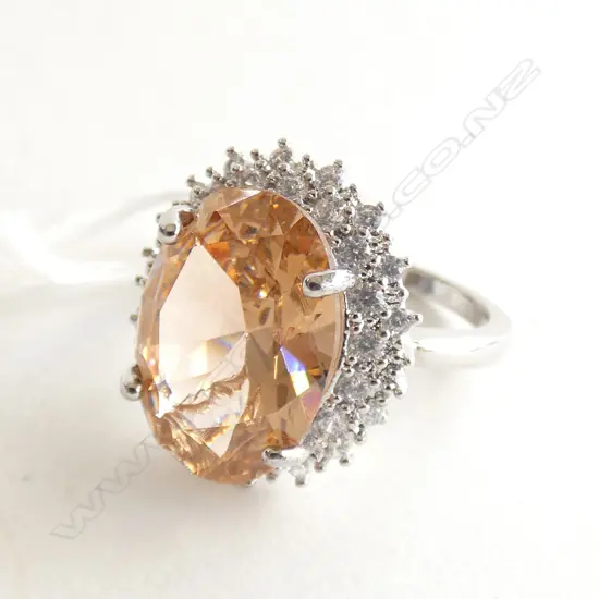 FANCY SILVER RING SET WITH CZ. THE LGE COLOURED....