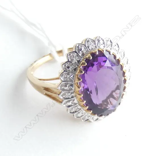 9CT DIAMOND? & PURPLE STONE RING...