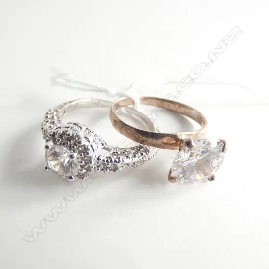TWO SILVER AND FAUX DIAMOND RINGS
