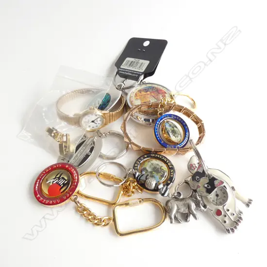 TIN OF WATCHES AND INTERNATIONAL KEY RINGS