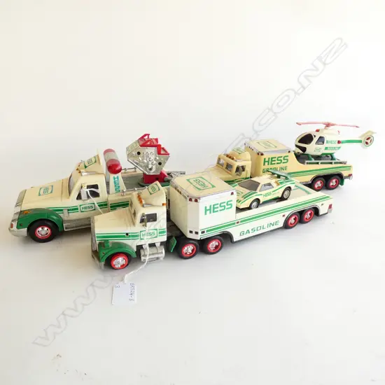 3 HESS GASOLINE TOY TRUCKS; 1 WITH HELICOPTER/1 WTH RACING CAR/1 TOW TRUCK L  370MM