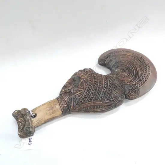 Carved resin patu