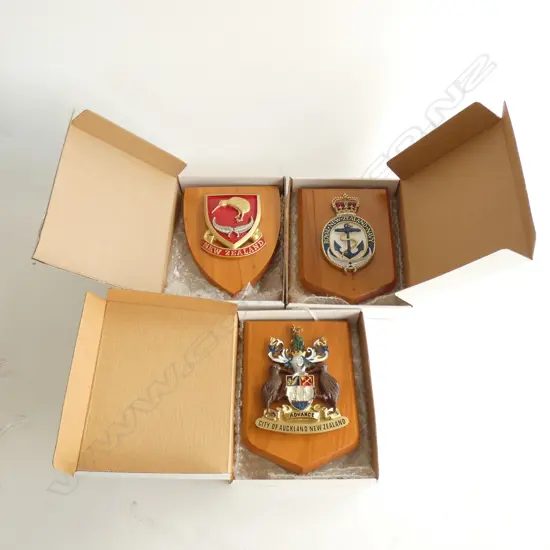 3 BOXED WOODEN PLAQUES WITH CRESTS; NZ KIWI / CITY OF AUCKLAND / RNZ NAVY  165 X 130MM