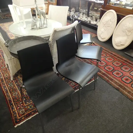 4 CONTEMPORARY BLACK PLASTIC CHAIRS 